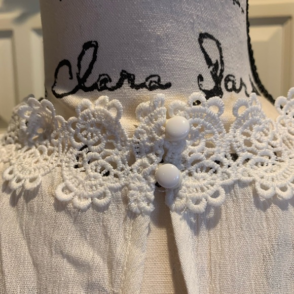 Angel + Premium reversible white top with white button detail and lace trim. - Picture 2 of 3